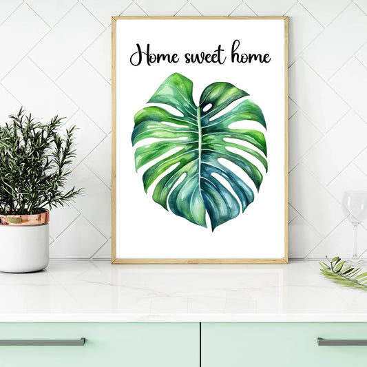 Framed monstera leaf wall art with 'Home sweet home' text, modern kitchen decor