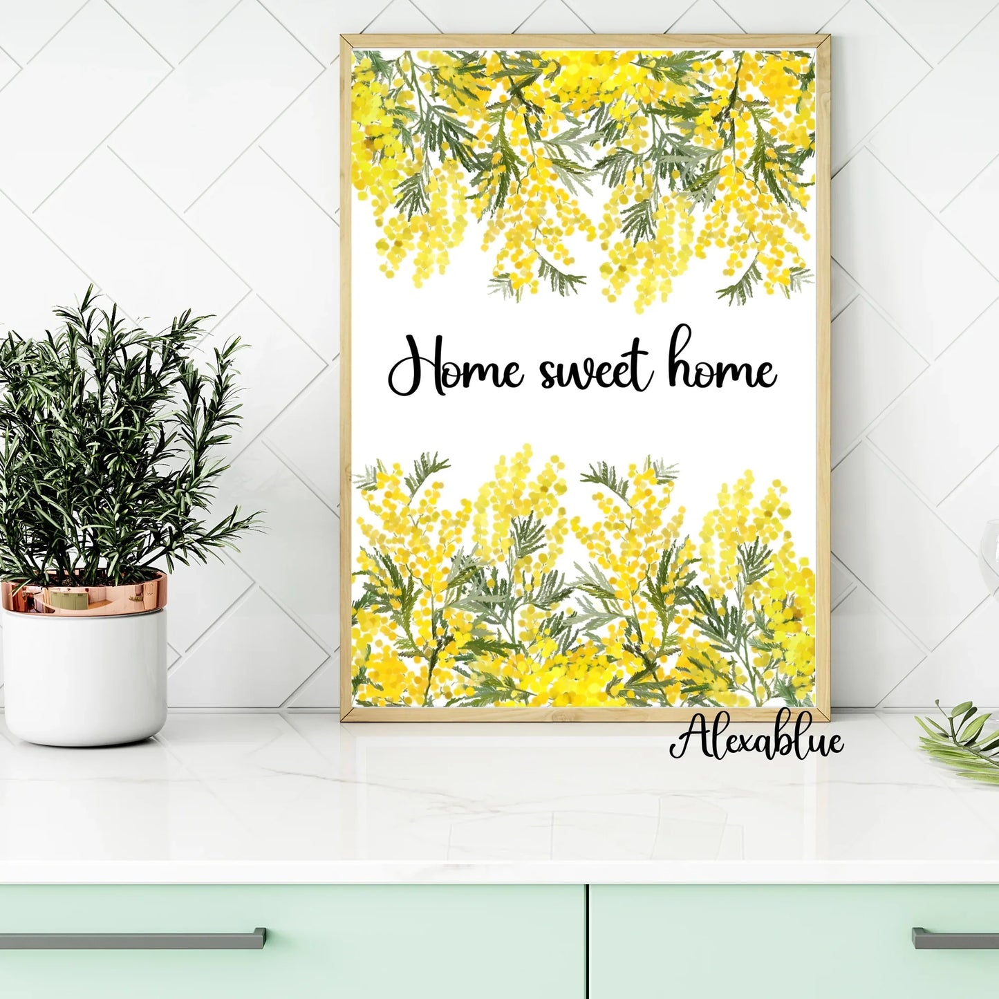 Floral kitchen decor with framed 'Home sweet home' print, yellow mimosa flowers, and potted plant.