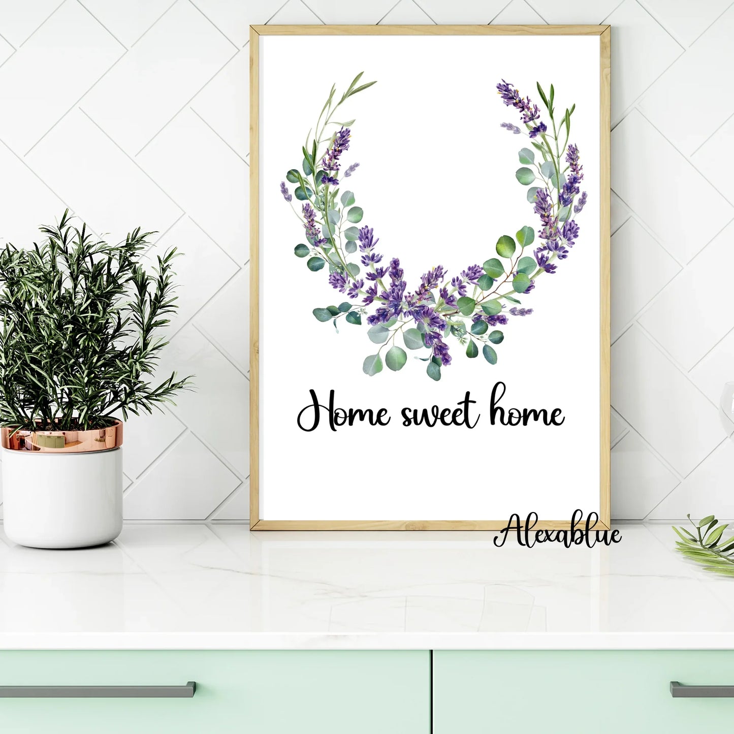 Framed floral home decor print with 'Home sweet home' text on a modern kitchen counter